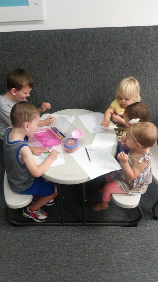 Children all coloring together at Fitness 19.