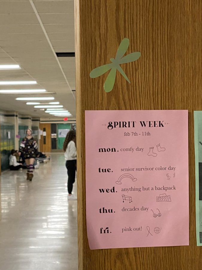 On Mrs. Borsts door of room 111, is a schedule for Spirit Week. With Monday being Comfy Day, Tuesday being Senior Survivor Color Day, Wednesday being Anything But a Backpack Day, Thursday is Decades Day, and, finally, Friday is Pink Out! Students who participate in these days will gain Pride Points for their first hour in contribution for a prize later in the year.