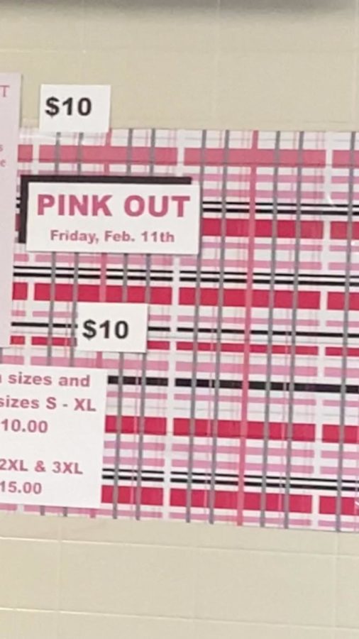 An ad for Pink Out T-shirts is hung up by the Cats Corner.